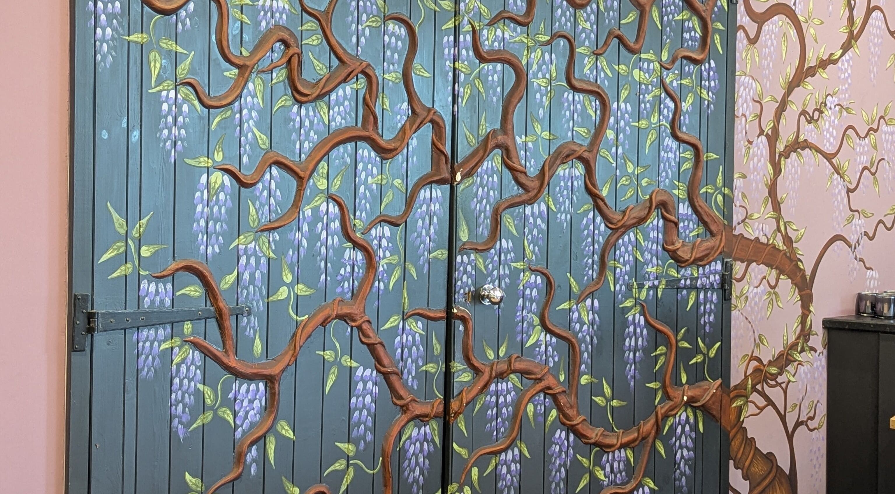 Beautiful floral mural on a wall at Gardenia Beauty at Lakeside, Hambleton, England, GB.