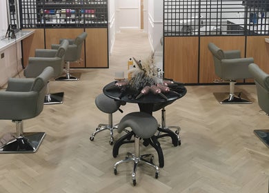Chic salon space at FAB Facial Aesthetics & Beauty in Dunstable, England, GB with stylish chairs and mirrors.