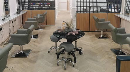 Chic salon space at FAB Facial Aesthetics & Beauty in Dunstable, England, GB with stylish chairs and mirrors.