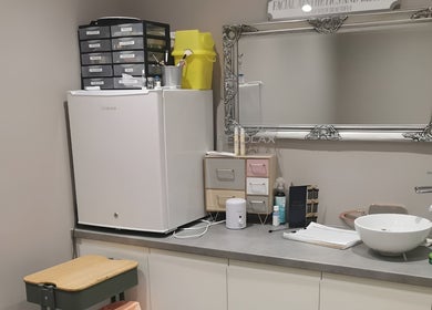 Modern treatment area at FAB Facial Aesthetics & Beauty, Dunstable, England, GB, with mirror and cosmetic tools.