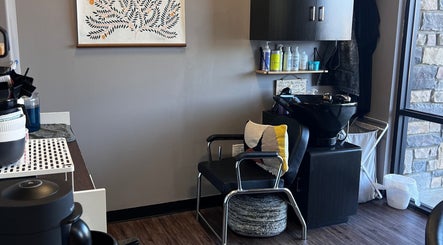 Modern salon interior at Mariah Allison Hair in Flower Mound, Texas, US, featuring a stylish chair and hair products.