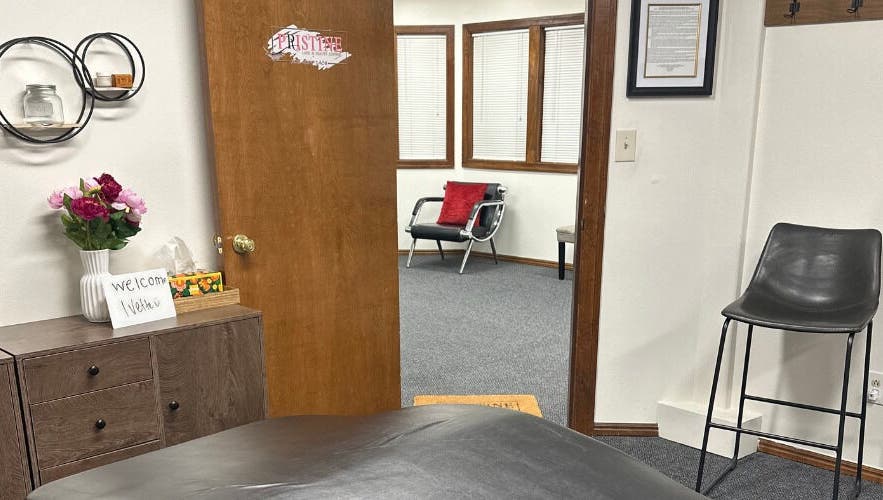 Inviting interior of Pristine Lash & Beauty Lounge in Idaho Falls, Idaho, US, featuring a cozy welcome sign.