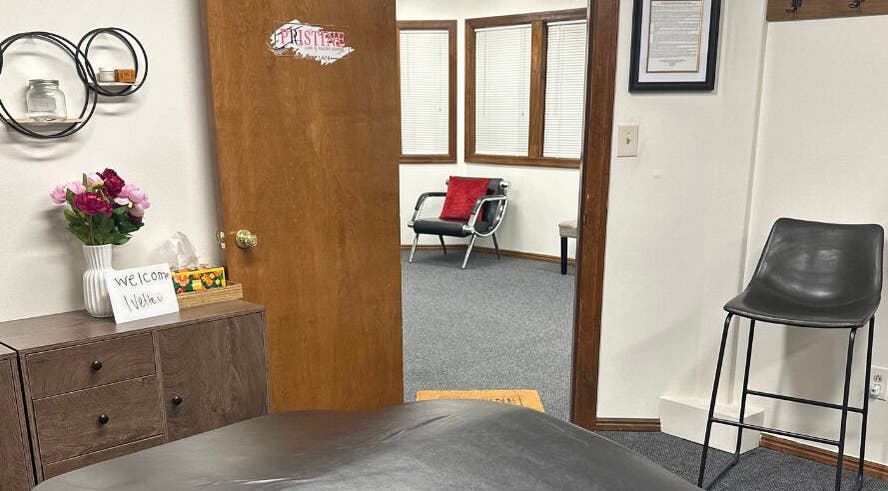 Inviting interior of Pristine Lash & Beauty Lounge in Idaho Falls, Idaho, US, featuring a cozy welcome sign.