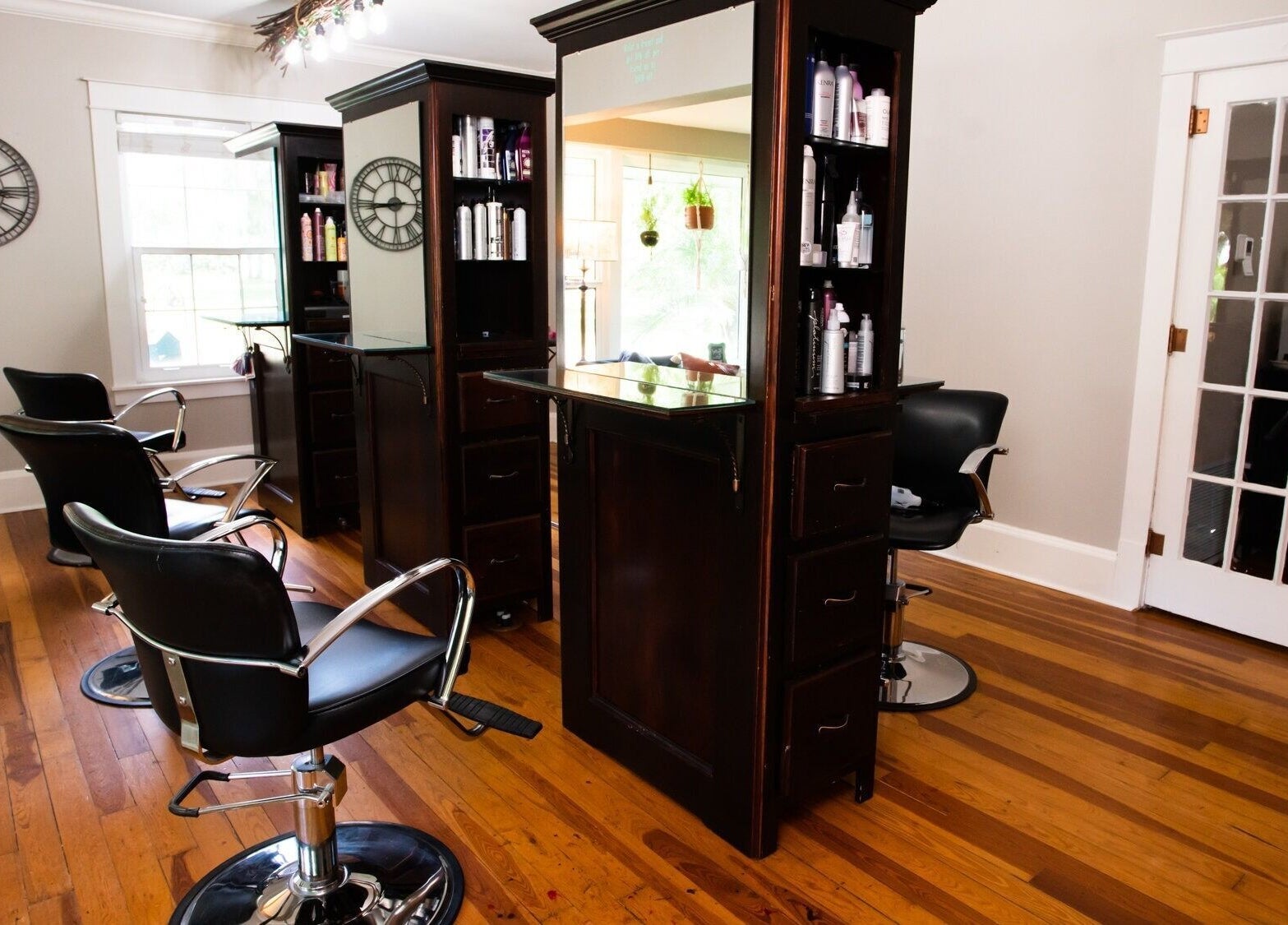 Luxurious salon chairs and mirrors at The Emerald Fox, Tavares, Florida, US beauty and wellness venue.