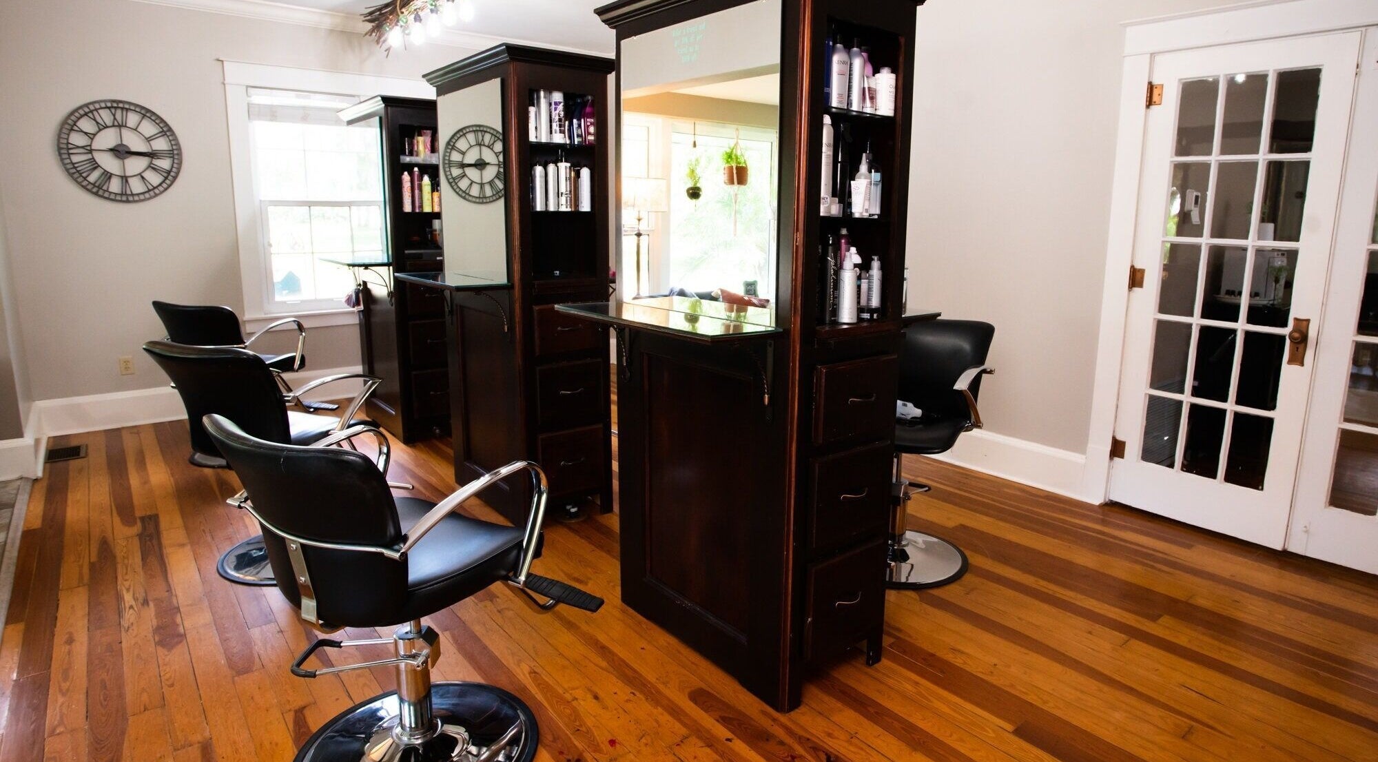Luxurious salon chairs and mirrors at The Emerald Fox, Tavares, Florida, US beauty and wellness venue.