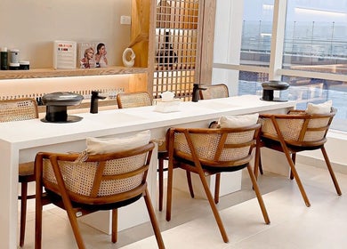 Chic nail salon at Tiara The Spa, الخبر, المنطقة الشرقية, SA. Modern chairs and bright ambiance.