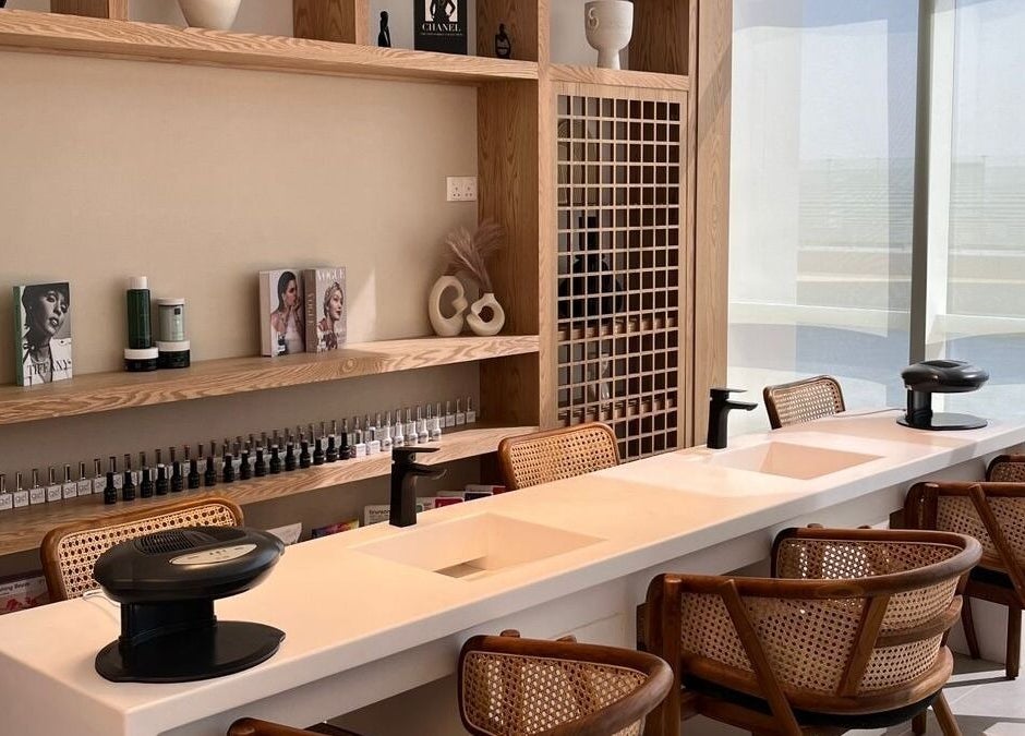 Manicure area at Tiara The Spa, الخبر, المنطقة الشرقية, SA featuring stylish wooden decor and natural lighting.