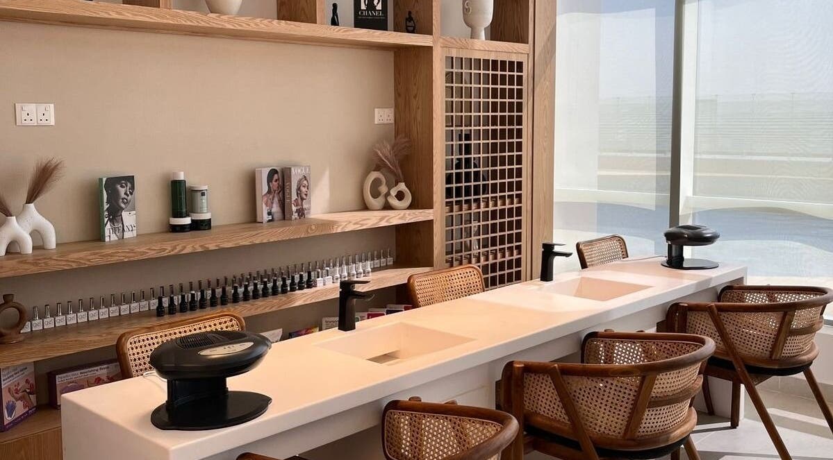 Manicure area at Tiara The Spa, الخبر, المنطقة الشرقية, SA featuring stylish wooden decor and natural lighting.