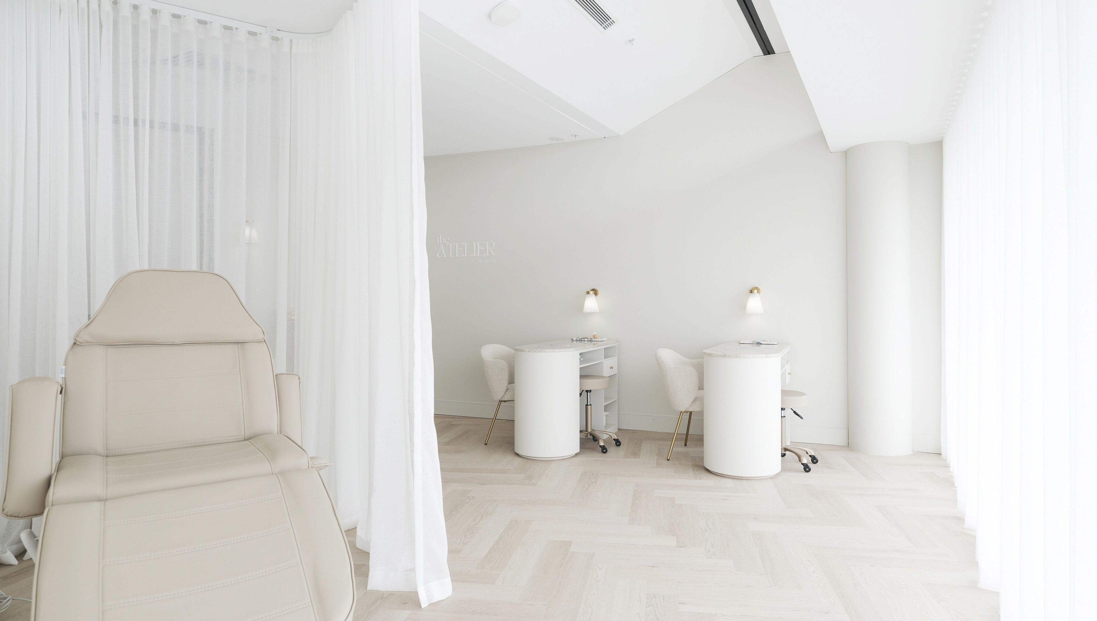 Tranquil beauty space at The Atelier Double Bay, Double Bay, New South Wales, AU with chairs and soft lighting.