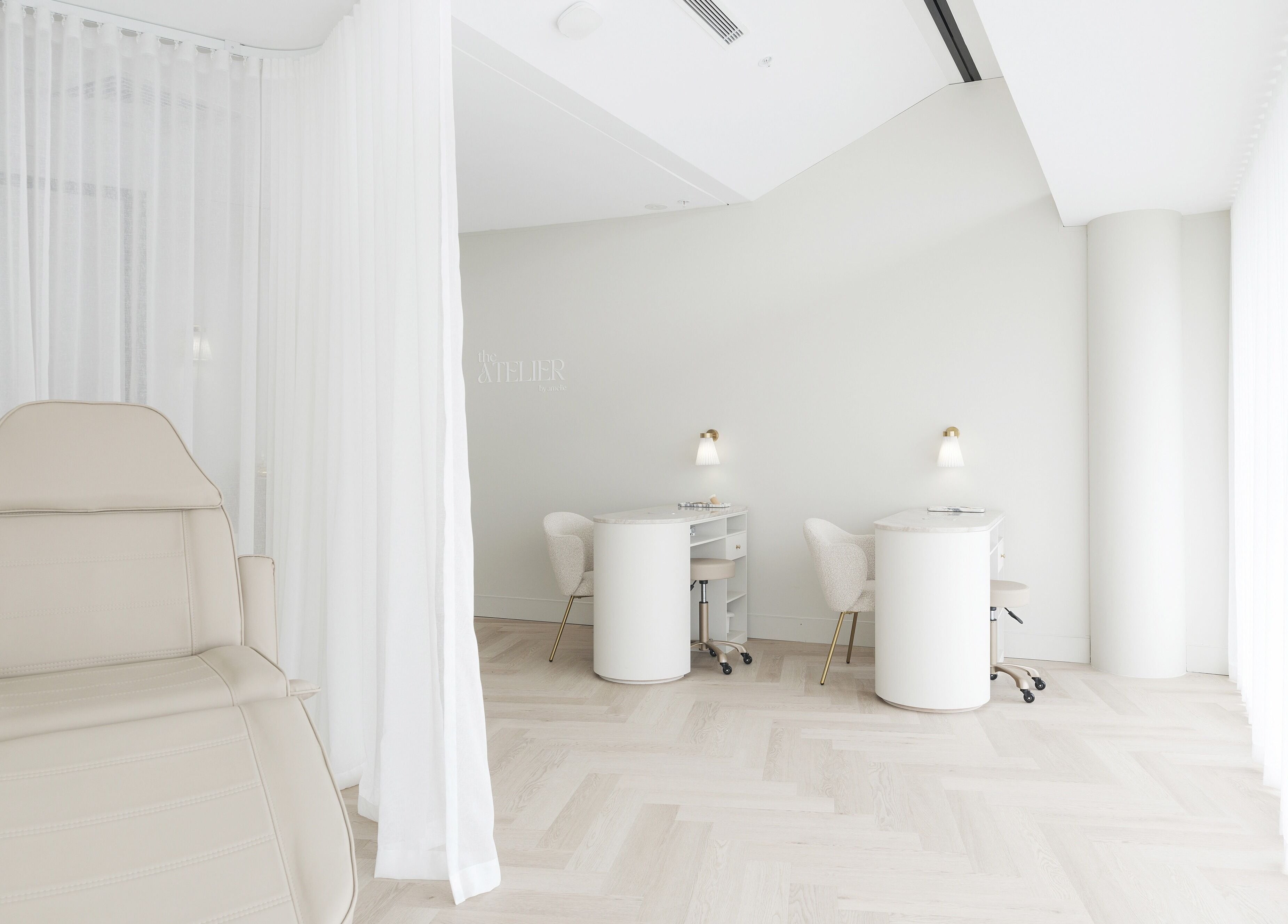 Tranquil beauty space at The Atelier Double Bay, Double Bay, New South Wales, AU with chairs and soft lighting.