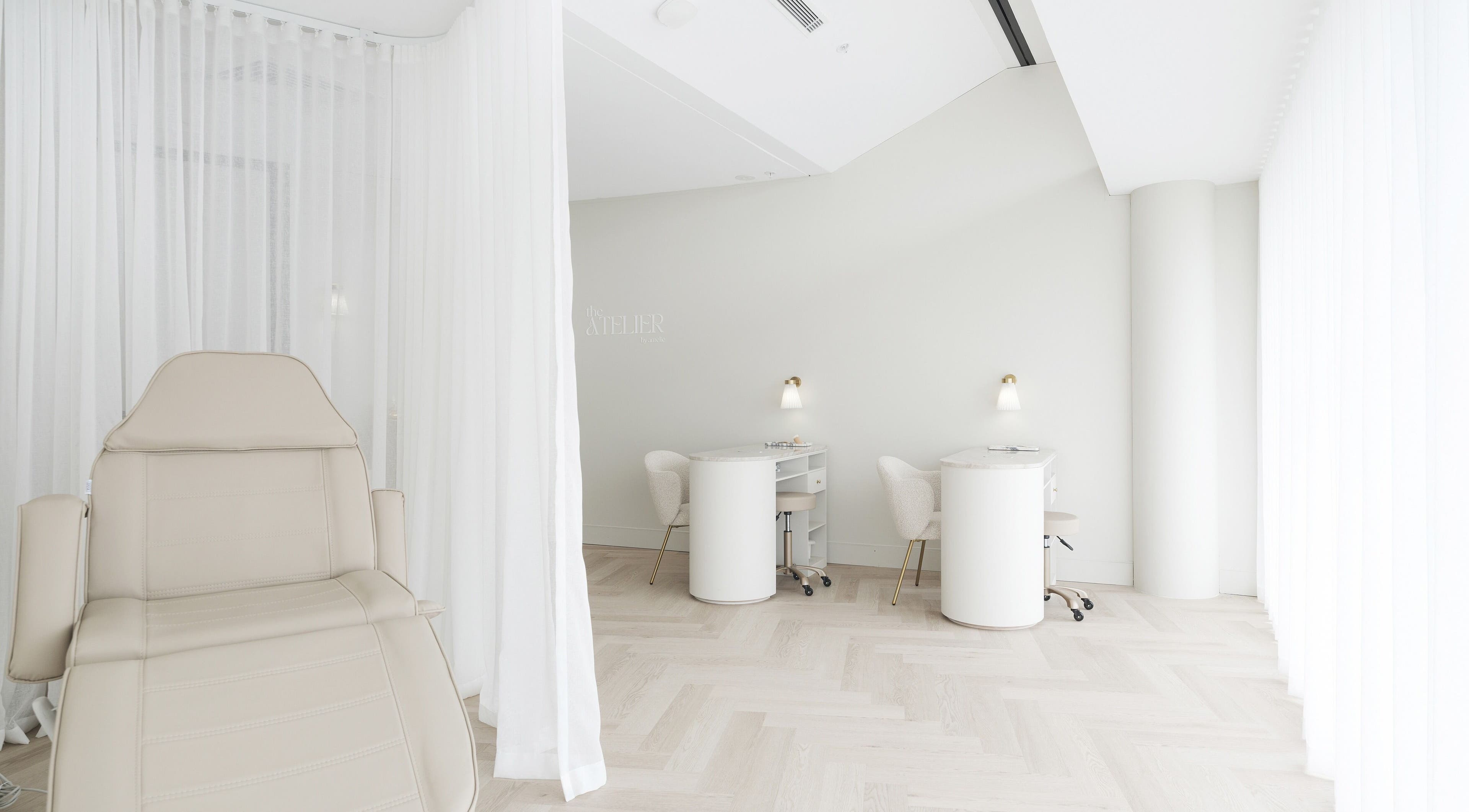 Tranquil beauty space at The Atelier Double Bay, Double Bay, New South Wales, AU with chairs and soft lighting.