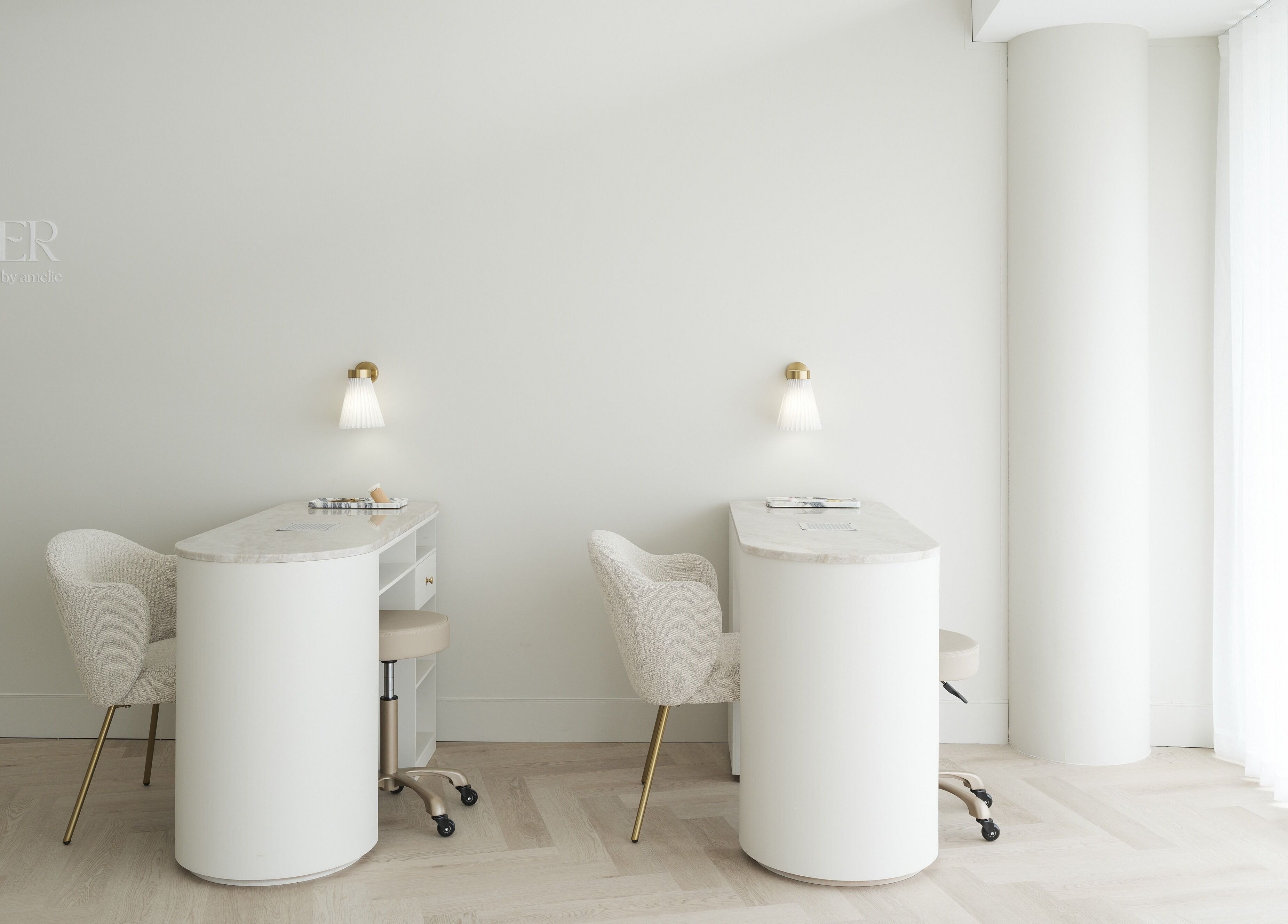 Chic nail stations at The Atelier Double Bay, Double Bay, New South Wales, AU with sleek chairs and ambient lighting.