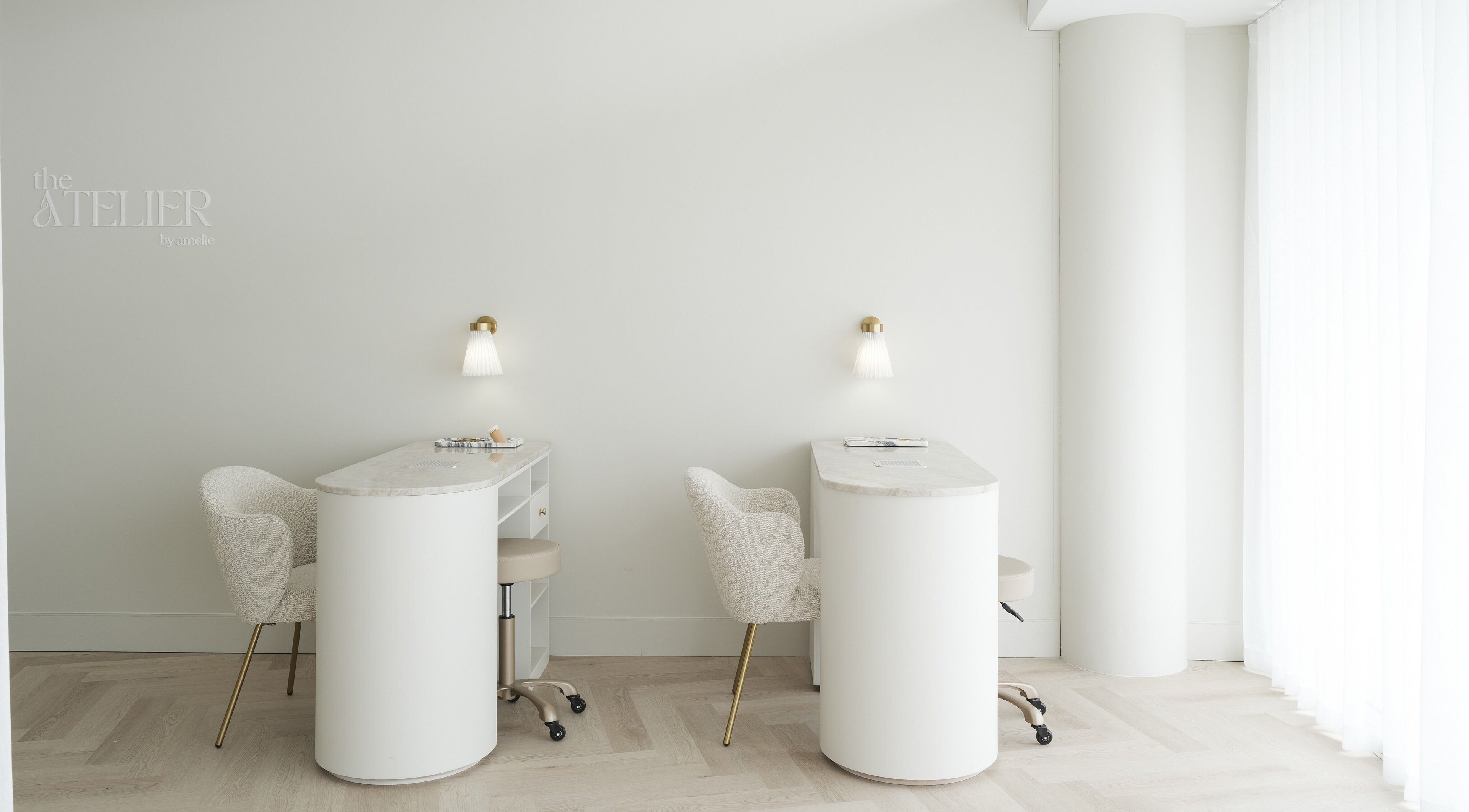 Chic nail stations at The Atelier Double Bay, Double Bay, New South Wales, AU with sleek chairs and ambient lighting.