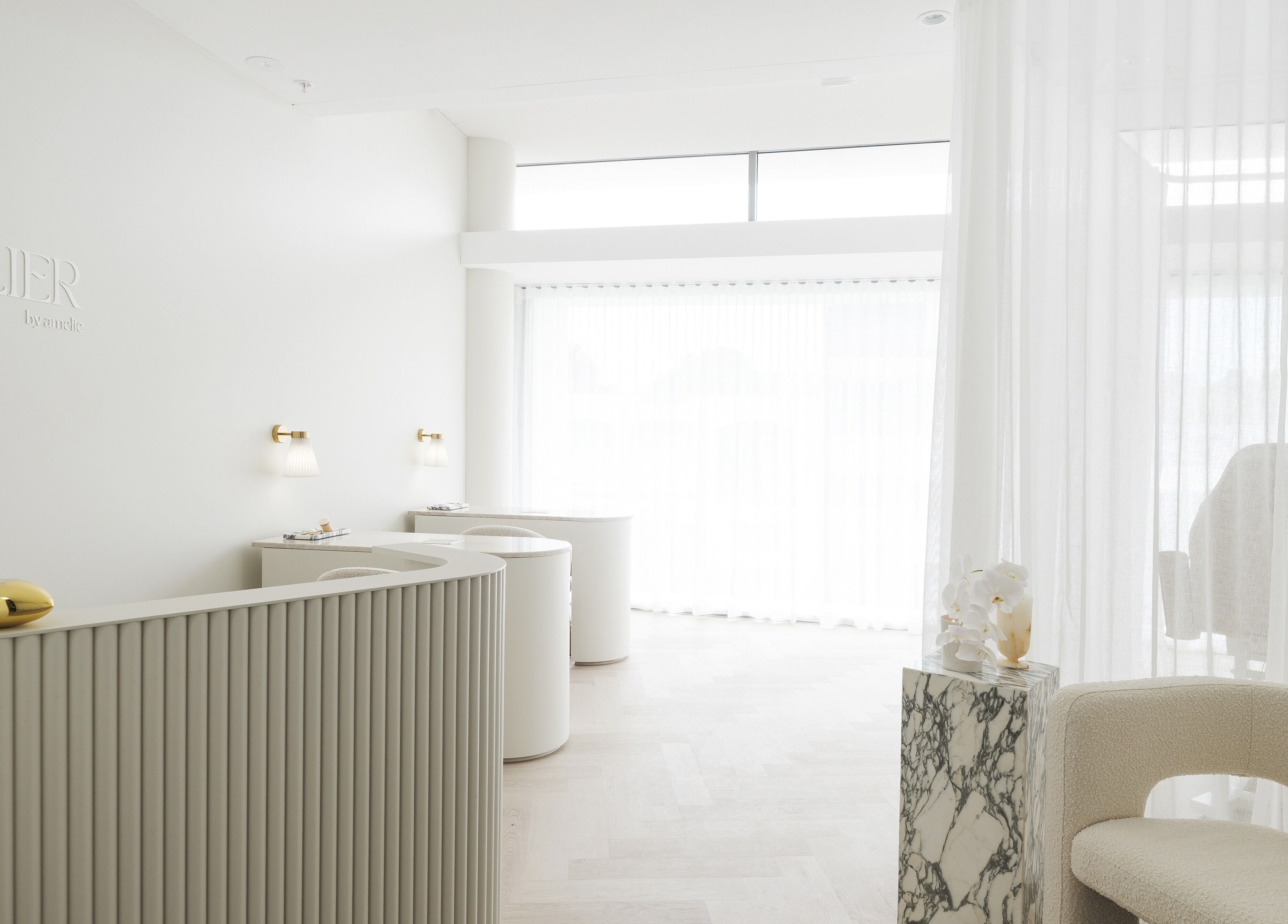 Bright, modern reception at The Atelier Double Bay, Double Bay, New South Wales, AU with chic decor and soft lighting.