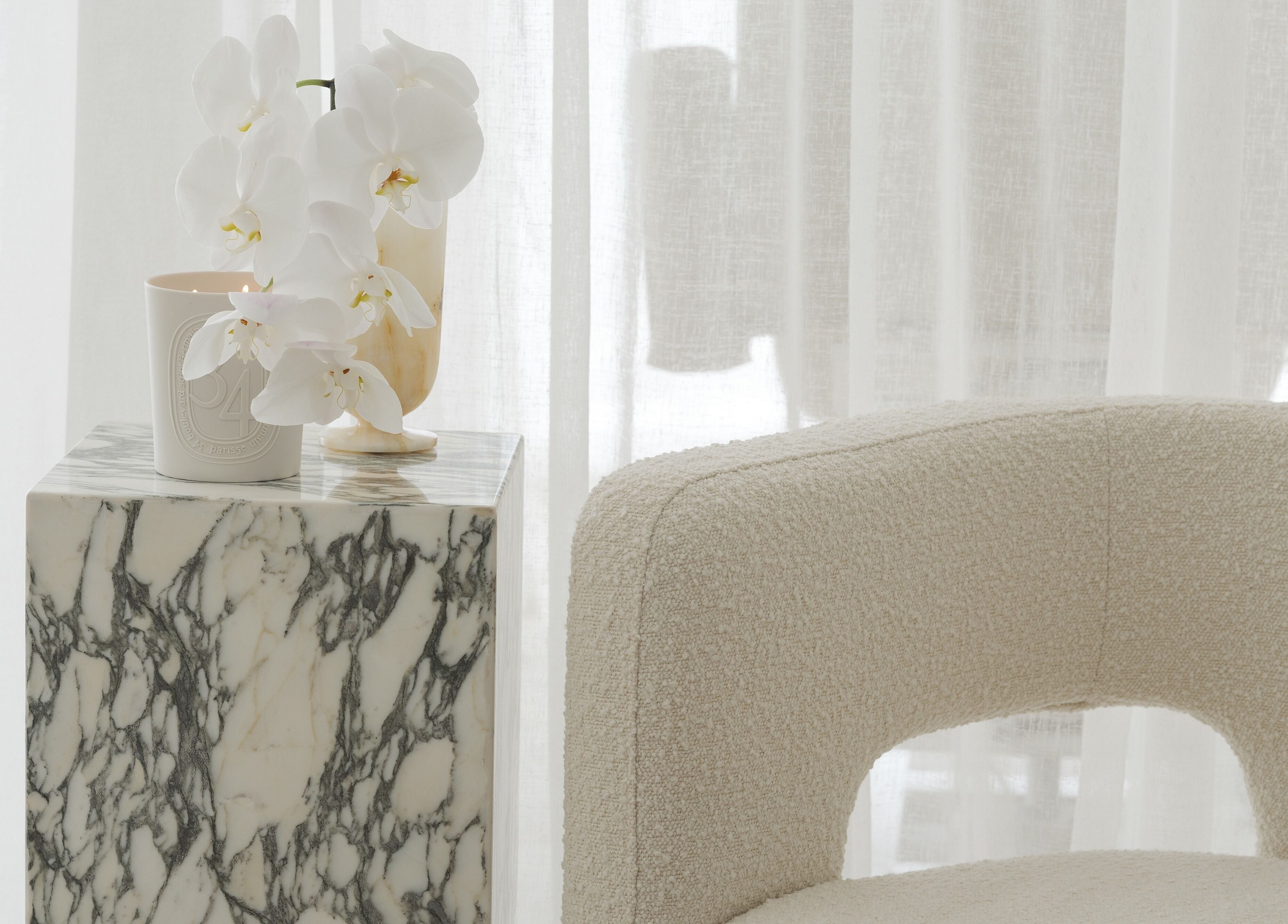 Elegant marble table with white orchid at The Atelier Double Bay, Double Bay, New South Wales, AU.