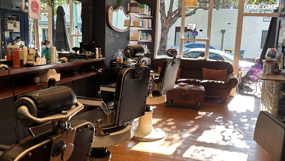 Relaxing interior of Grand Royal Barbers - Darlinghurst in Sydney, New South Wales, AU with modern barber chairs.