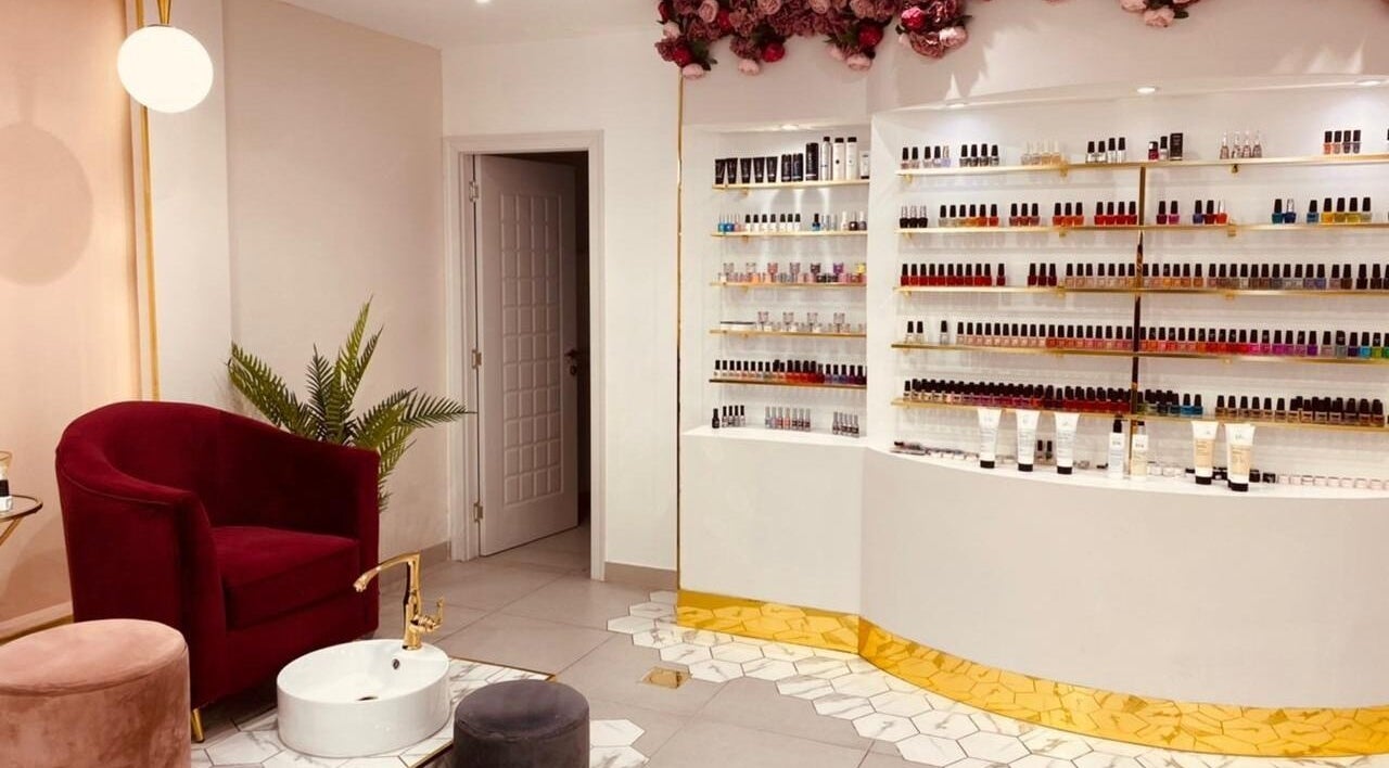 Elegant nail polish display at Saray Beauty Centre in Sharjah, Sharjah, AE with luxurious chair.