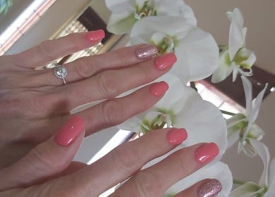 Elegant pink manicured nails with glitter accent at Star Glam Nails, Sandton, Gauteng, ZA, featuring white orchids.