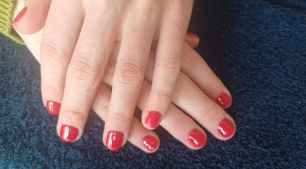 Red manicured nails showcase elegance at Star Glam Nails, Sandton, Gauteng, ZA.