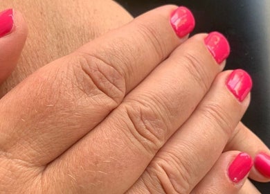 Close-up of vibrant pink nails at Star Glam Nails, Sandton, Gauteng, ZA showcasing expert manicure.