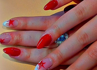 Stylish red star nail design at Star Glam Nails, Sandton, Gauteng, ZA. Enhance your look with unique nail art.