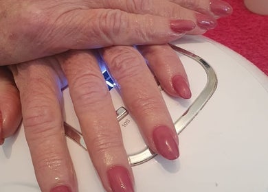 Beautiful pink manicure at Star Glam Nails, Sandton, Gauteng, ZA. Perfectly shaped nails under UV light.