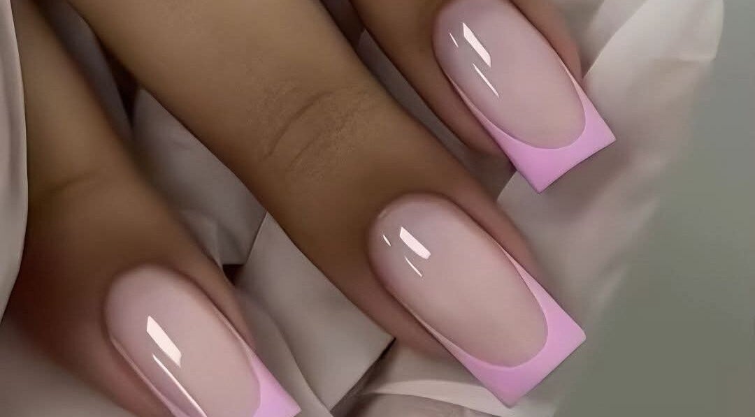 Elegant pink-tipped manicure at Star Glam Nails in Sandton, Gauteng, ZA showcasing stylish nail art.