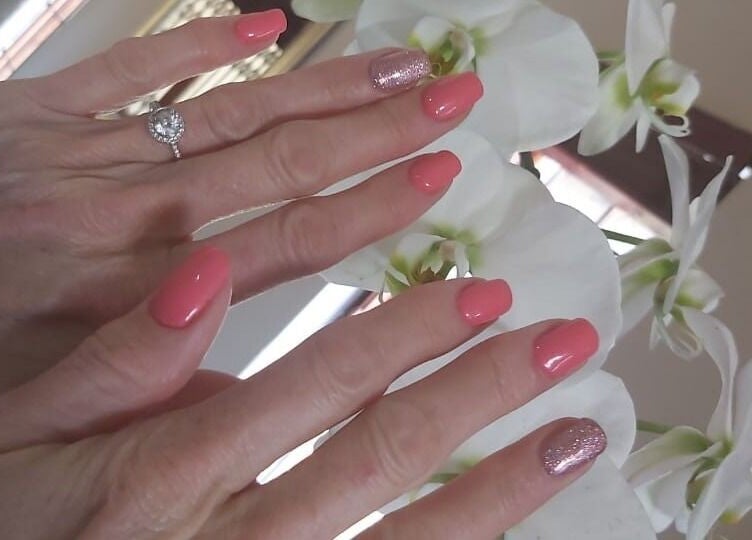 Elegant pink manicure with glitter accent at Star Glam Nails, Sandton, Gauteng, ZA, amidst white orchids.