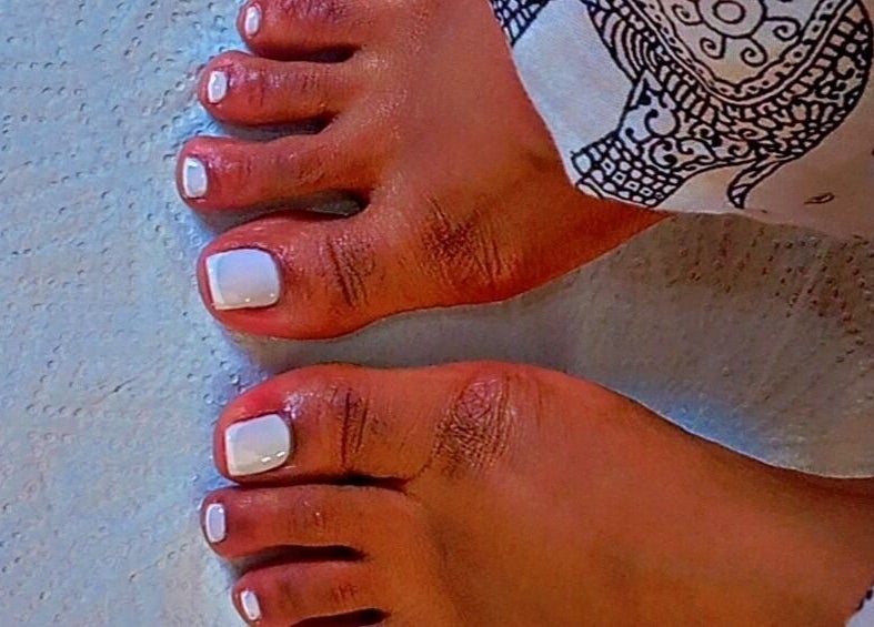 White polished toes at Star Glam Nails, Sandton, Gauteng, ZA, showcasing pristine pedicure services.
