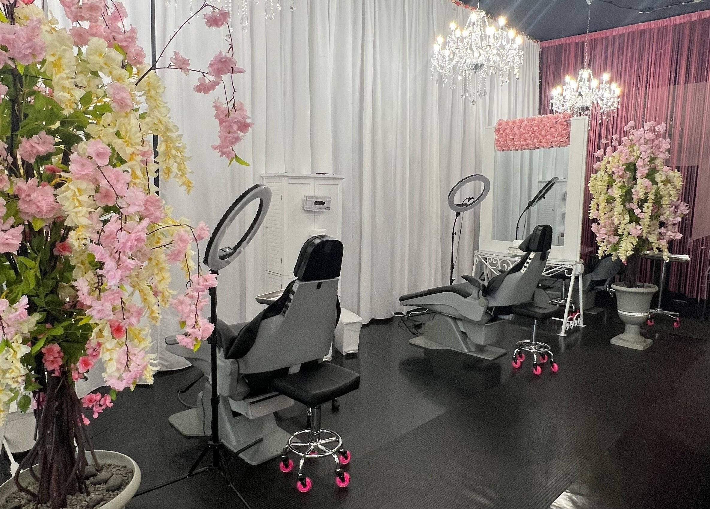 Luxurious interior of Beauty Clinic By Adriana in Perris, California, US, featuring chic decor and salon chairs.