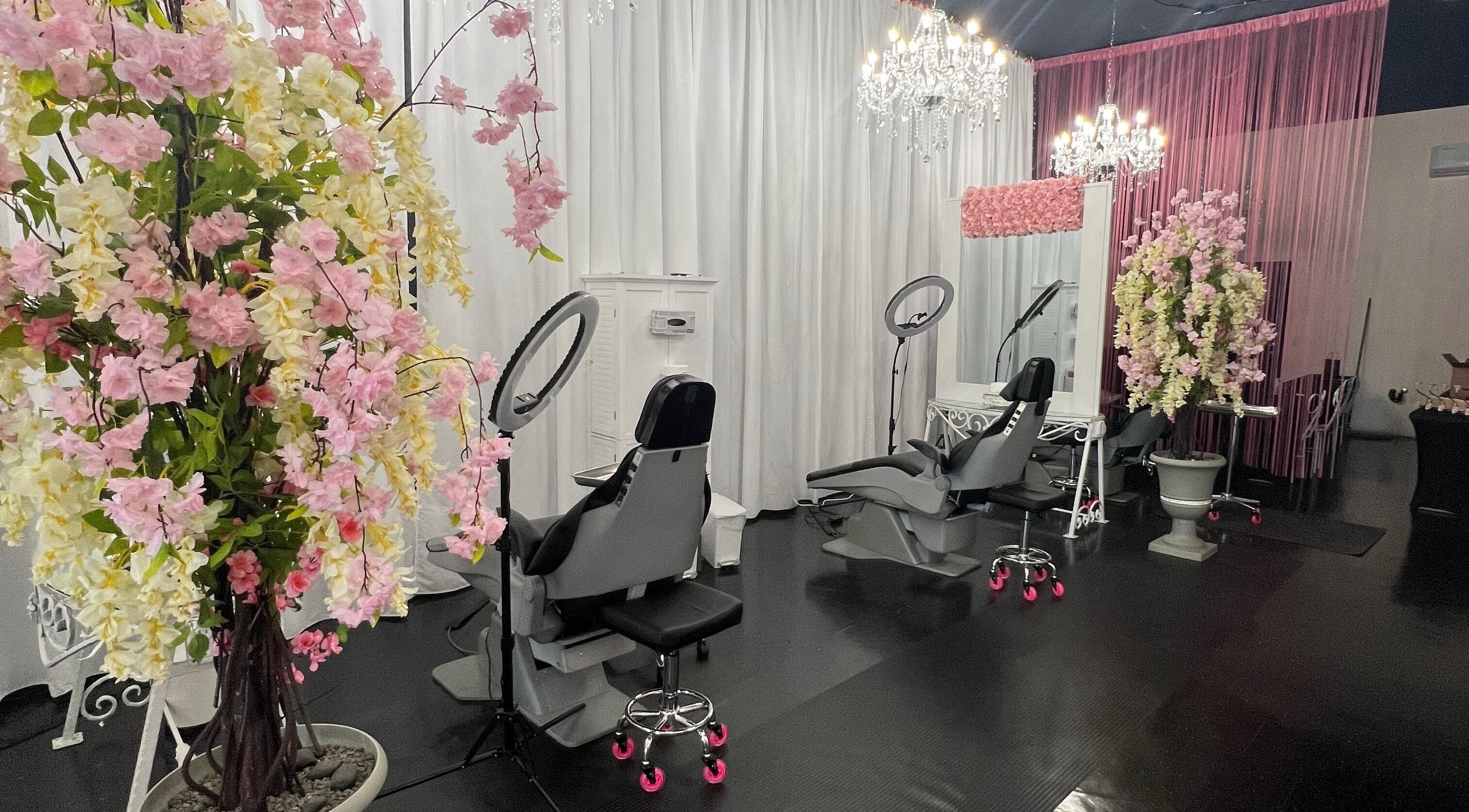 Luxurious interior of Beauty Clinic By Adriana in Perris, California, US, featuring chic decor and salon chairs.