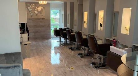 Modern salon chairs and decor at Trim N Tonic, Teignmouth, England, GB, enhancing a chic ambiance.