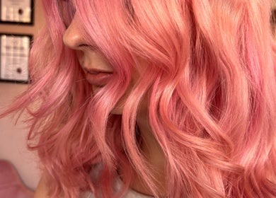 Close-up of pink wavy hair styled beautifully at Trim N Tonic, Teignmouth, England, GB.
