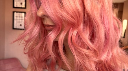 Close-up of pink wavy hair styled beautifully at Trim N Tonic, Teignmouth, England, GB.