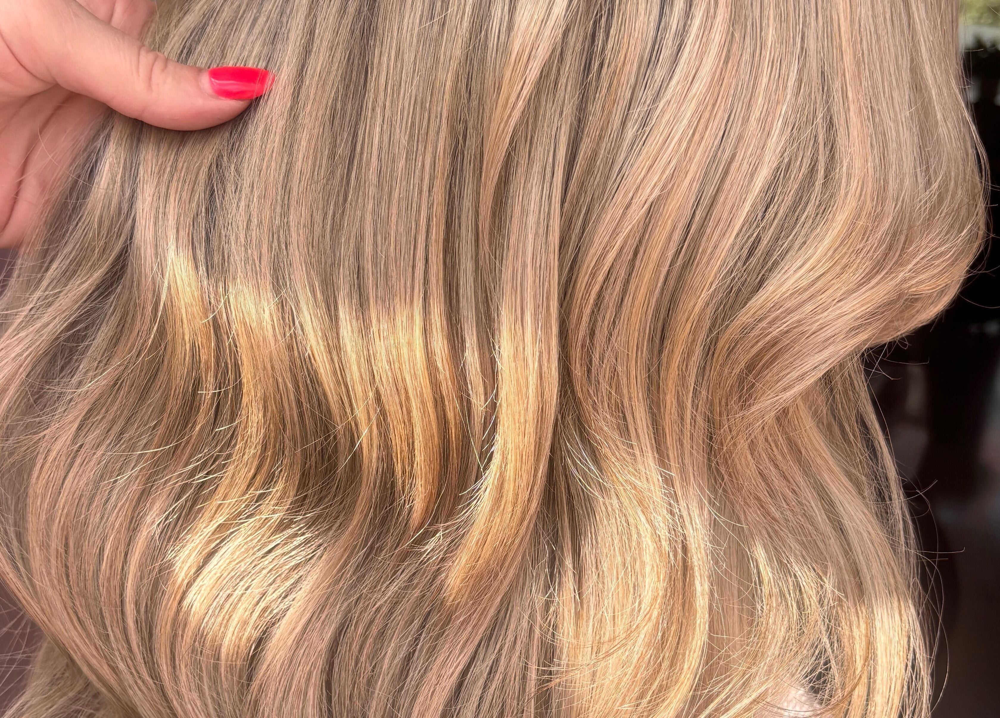 Perfectly styled golden waves at Trim N Tonic, Teignmouth, England, GB.