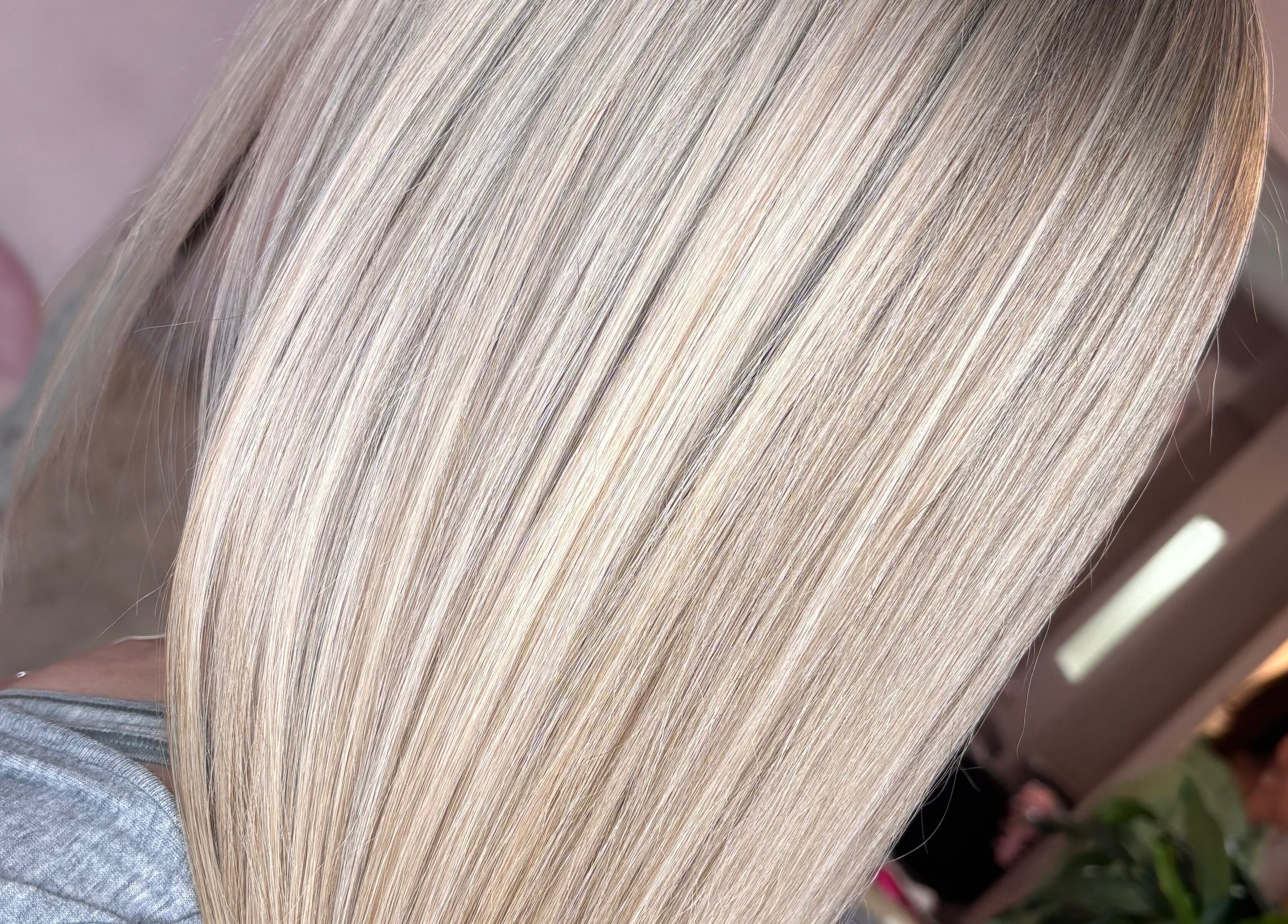 Silky, smooth blonde hair at Trim N Tonic, Teignmouth, England, GB.