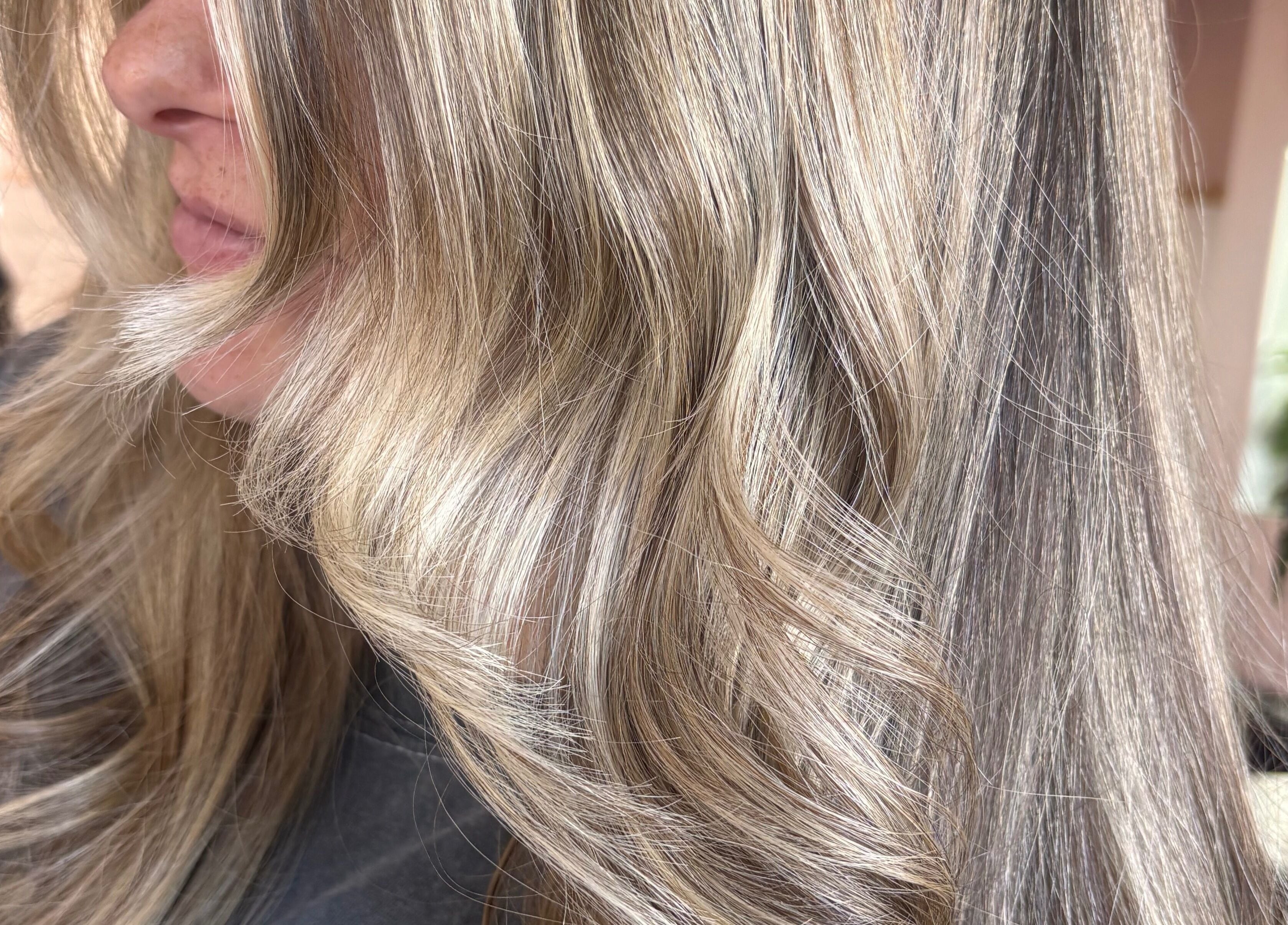 Blonde wavy hair styled at Trim N Tonic, Teignmouth, England, GB salon.