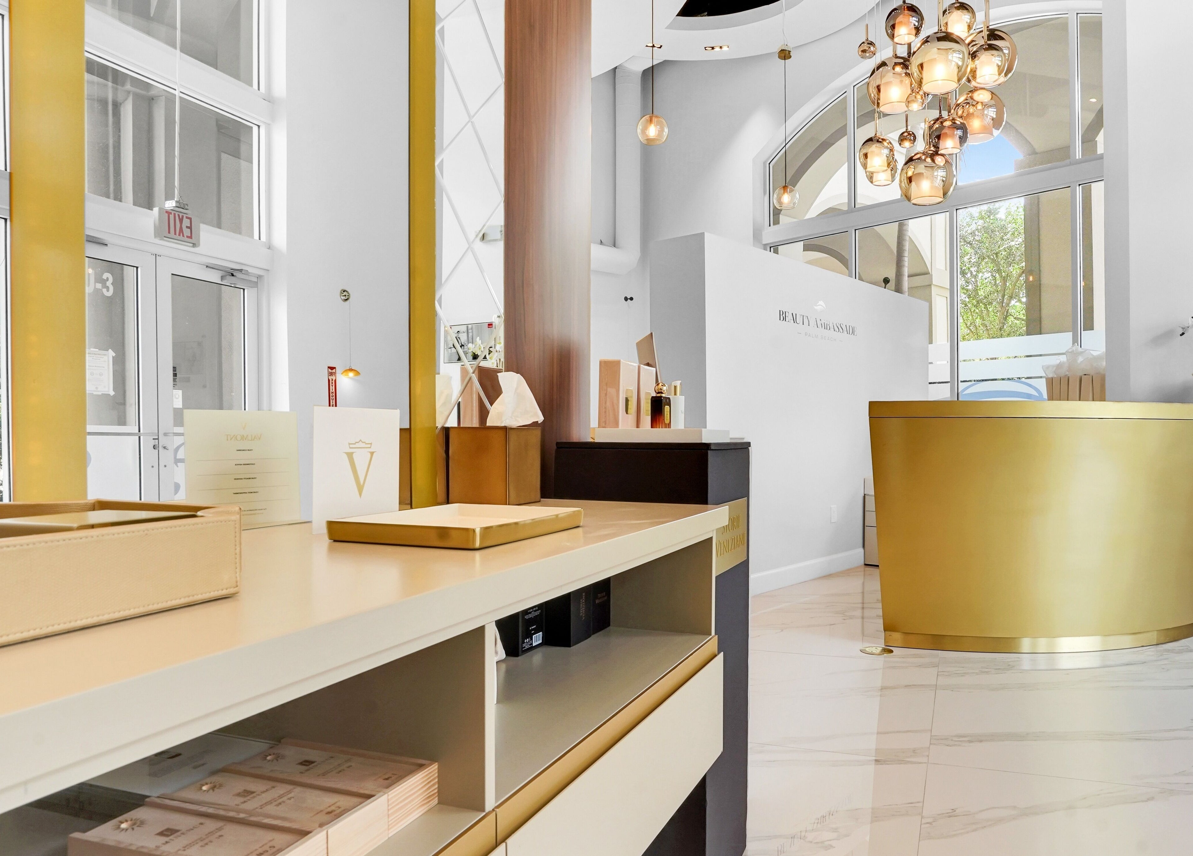 Elegant reception at Beauty Ambassade and Spa in West Palm Beach, Florida, US with golden decor.