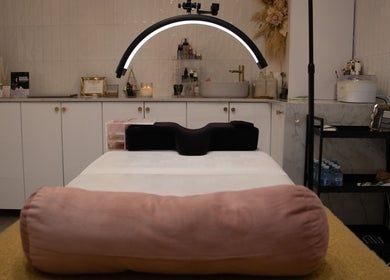Elegant treatment room at Reborn Lash Boutique | Sanctuary Cove, Gold Coast, Queensland, AU, featuring a plush bed.