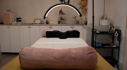 Elegant treatment room at Reborn Lash Boutique | Sanctuary Cove, Gold Coast, Queensland, AU, featuring a plush bed.