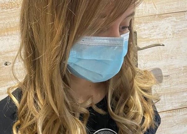 Customer with styled curls at Hair Logic in Alberton, Gauteng, ZA, showcasing salon quality.