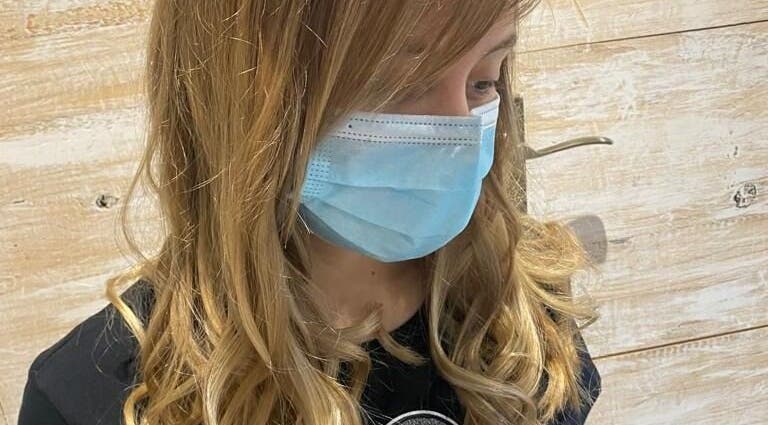 Customer with styled curls at Hair Logic in Alberton, Gauteng, ZA, showcasing salon quality.