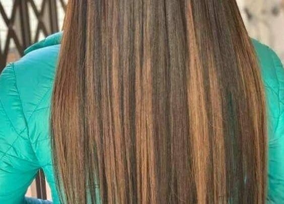 Smooth, long brown hair styled at Hair Logic, Alberton, Gauteng, ZA.