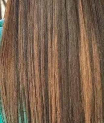 Smooth, long brown hair styled at Hair Logic, Alberton, Gauteng, ZA.