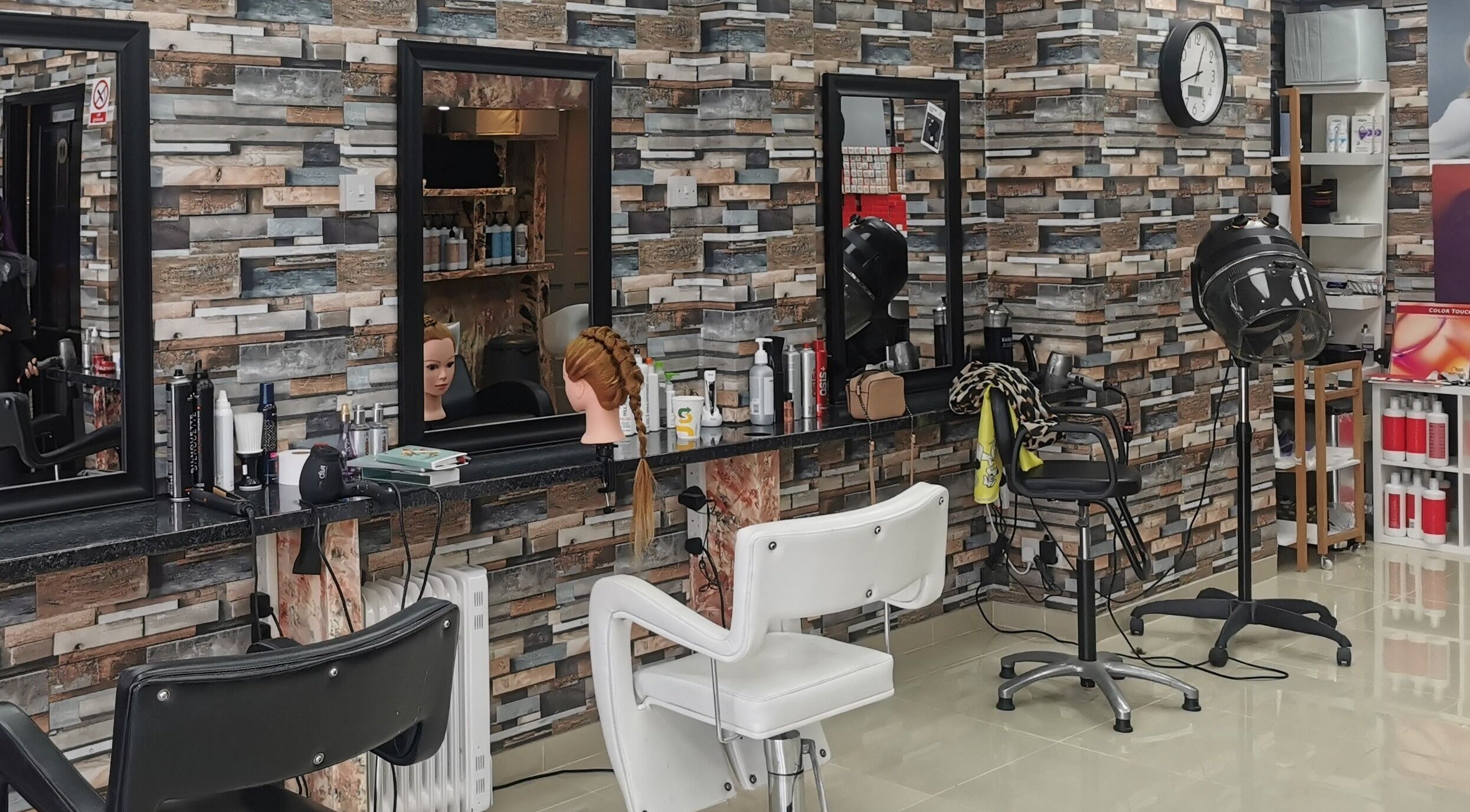 Modern salon interior of MEK Hair Studio, Marston Green, England, GB with professional styling stations.