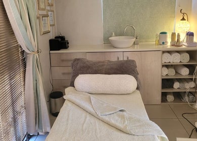 Relaxing treatment room at Belle Femme Waxing Specialist, Cape Town, Western Cape, ZA with soft lighting and cozy decor.