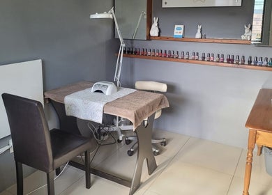 Cozy nail table at Belle Femme Waxing Specialist in Cape Town, Western Cape, ZA, showcasing nail polish variety.