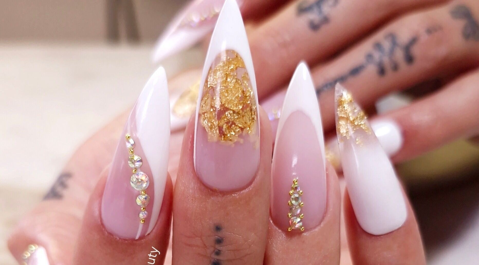 Stunning gold-accented nails showcased at Kaskada Beauty, Benoni, Gauteng, ZA.