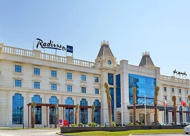 Exterior view of The One and Only Madhu Beauty Lounge in Ajman, Ajman, AE, featuring grand architecture.