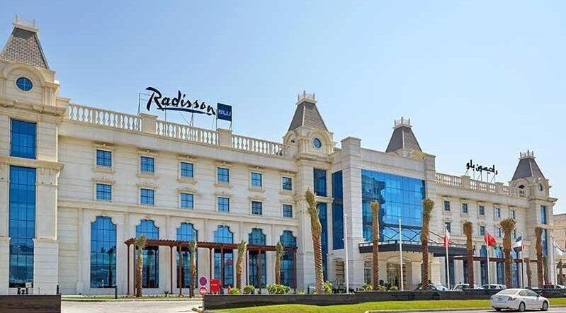 Exterior view of The One and Only Madhu Beauty Lounge in Ajman, Ajman, AE, featuring grand architecture.